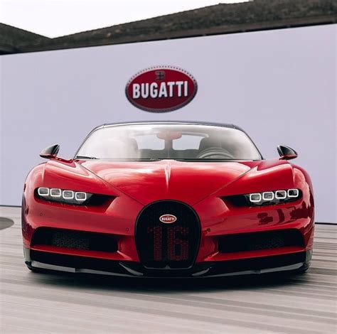 red bugatti sports car driving   sign   bugatti