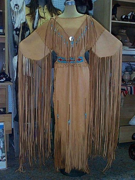 A Mannequin Dressed In Native American Clothing