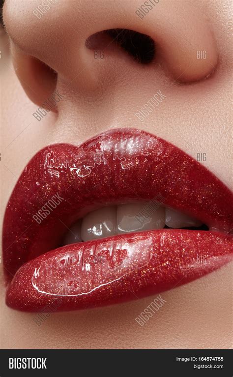 close up of female lips with bright makeup macro of woman s face fashion lip make up with red