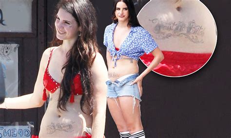 Lana Del Rey Reveals Large Faux Belly Tattoo As She Slips