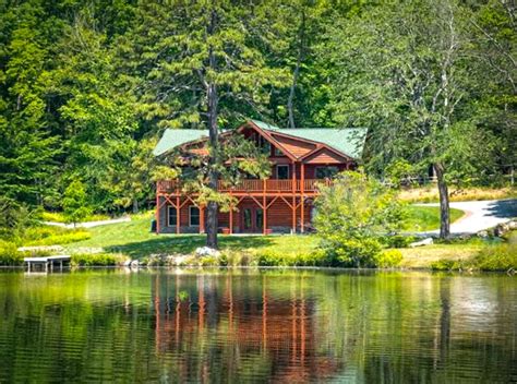lakefront log cabin    acres special finds unusual homes  sale