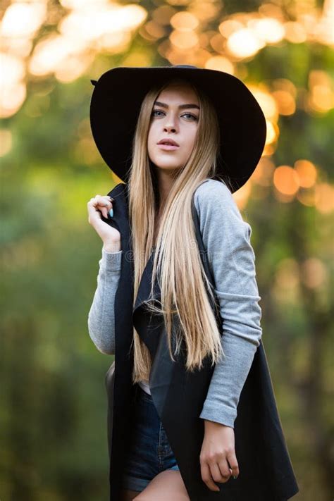 gorgeous stylish young woman wearing fashionable clothes stock photo
