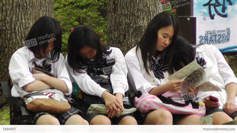 Japanese Schoolgirls Relaxing In Park In Yokohama Japan 12