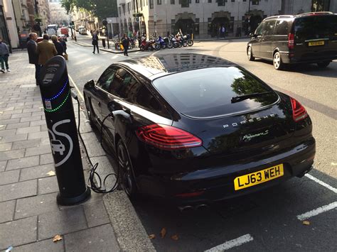porsche panamera s hybrid charging outside the office in