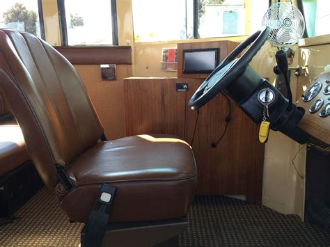 original driver seat reupholstered short bus school bus conversion