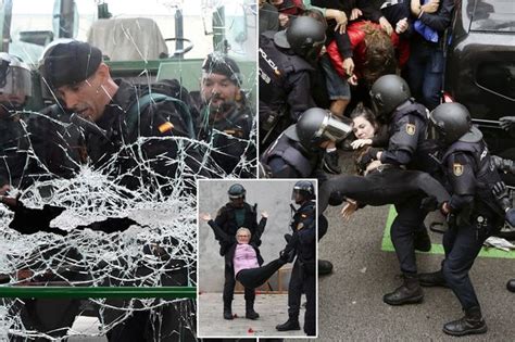 spanish riot police fire rubber bullets and raid polling