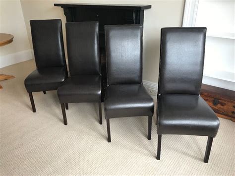 good condition dark brown leather dining chairs