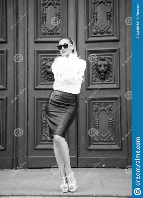Beauty Girl With Glamour Look Woman In High Heel Shoes On Red Door In