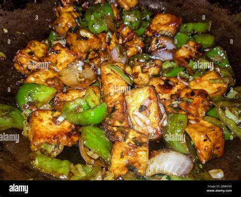 A Closeup Shot Of Homemade Chilly Paneer Hot Spicy Dry Cheese Recipe