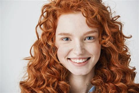 Close Up Of Redhead Beautiful Girl With Freckles Smiling Looking At