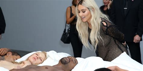 kim kardashian giggles as she looks at naked taylor swift at kanye west exhibition metro news