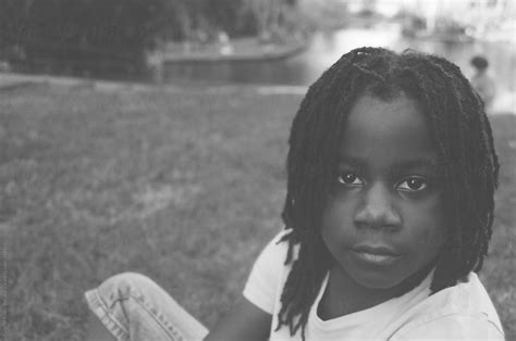 black and white portrait of an african american girl outdoors by