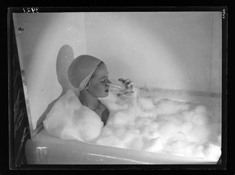 [woman Drinking In Bubble Bath] International Center Of Photography