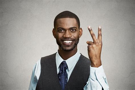 businessman giving victory  fingers sign stock photo image
