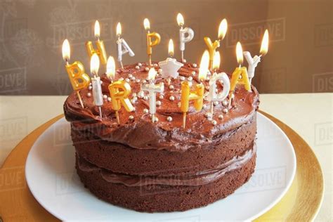 chocolate birthday cake  lots  candles stock photo dissolve
