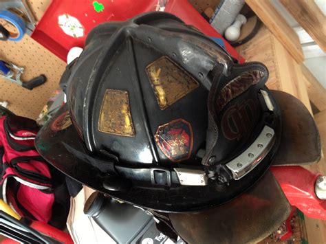 melted helmet  badge  honor firehouse