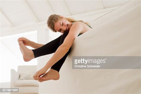 Woman Dangling Legs Over Sofa Photo Getty Images