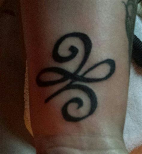 symbol   beginnings tattoo   wrist