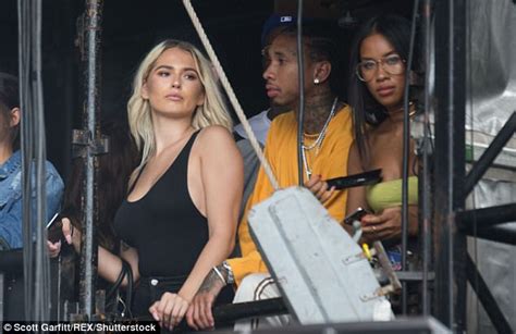 busty blonde flirts and caresses tyga s hand at wireless daily mail