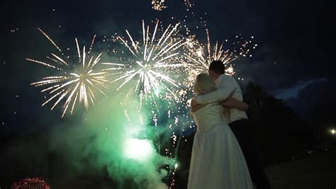 happy wedding couple watching fireworks stock footage