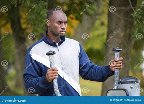 young man working   outdoor gym stock image image  african exercise