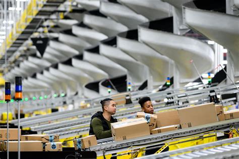 amazon pays warehouse employees  tweet   jobs vox