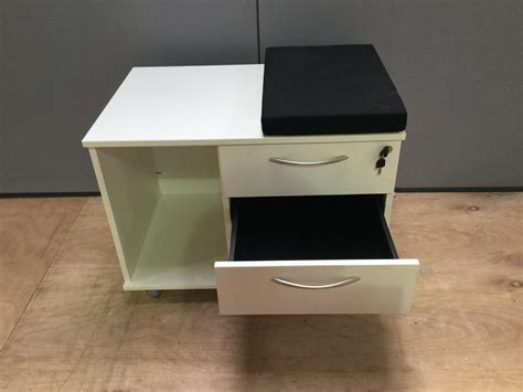 white wooden under desk pedestal with three drawers