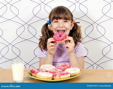 girl eating donuts stock photo image  cute