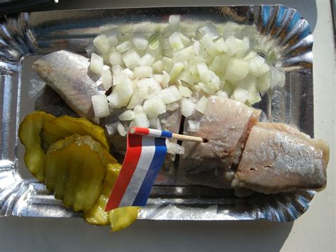 traditional dutch food zoute haring met uitjes en zuur raw salty herring  onions