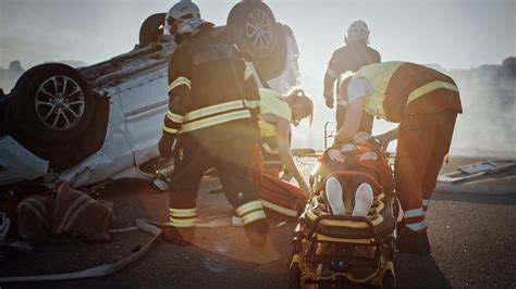car crash traffic accident scene rescue team  firefighters