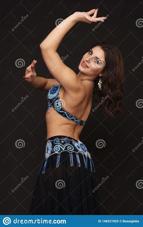 Beautiful Belly Dancer Perfoming Exotic Dance In Red