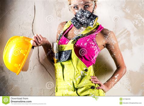 female wearing a respirator posing indoors stock image