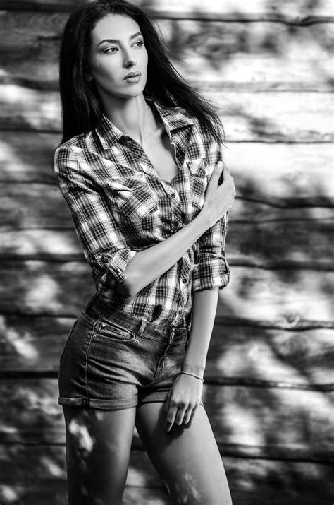Young Sensual And Beauty Brunette Woman Pose Against Wooden Background