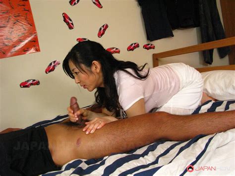 sweet asian beauty emiko koike is sitting on her knees giving head to the hard member