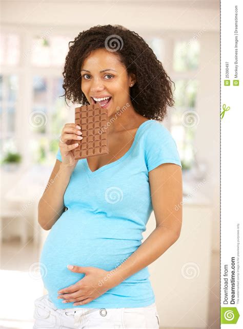 pregnant woman eating chocolate royalty free stock