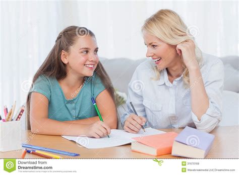 Cheerful Mother And Daughter Writing Together Stock Image Image Of
