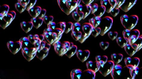 a lot of heart bubbles burst on black background funny 3d animation full hd 1080p stock video