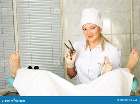 Gynecologist Examining Female Patient With Colposcope Royalty Free