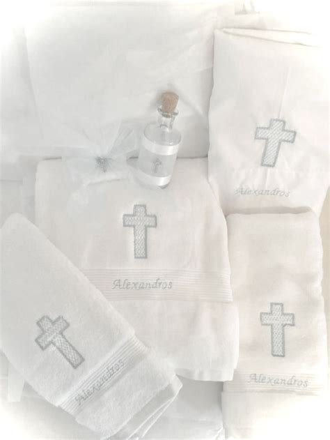 bunch  white towels  cross embroidered     bottle