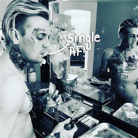 a naked aaron carter proudly announces he s single following