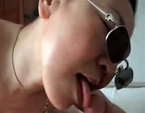 chubby asian milf in sunglasses blows hairy white cock of