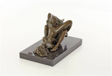 a bronze sculpture of a lesbian love scene