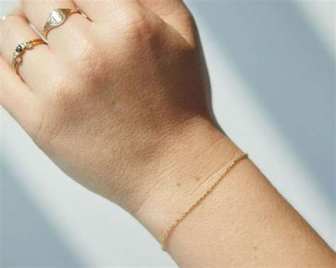 woman  bracelet permanently welded   wrist  latest beauty trend creation attractions
