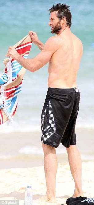 hugh jackman shows off his wolverine physique at the beach