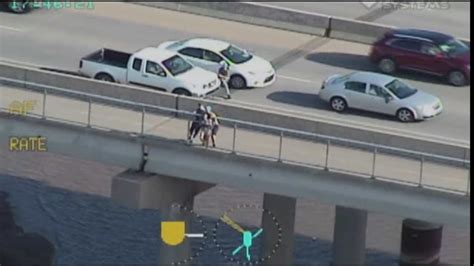 tpd releases video  men stopping woman  jumping  bridge