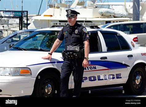 policeman standing   police car stock photo alamy