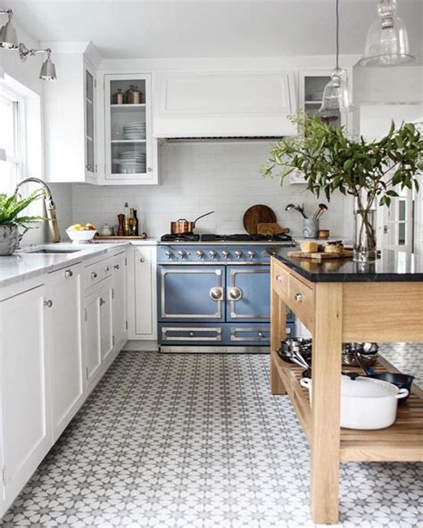 pin  white kitchen cabinets dark tile floor