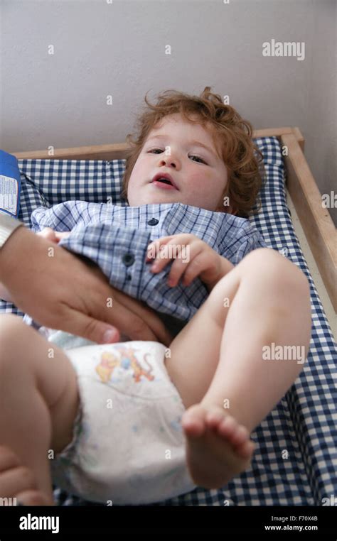 baby boy   nappy changed stock photo alamy