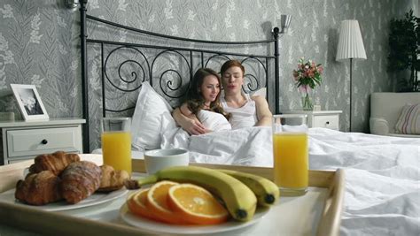 couple cuddling bed stock footage video shutterstock