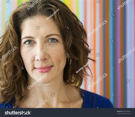average middle aged woman smiling   camera stock photo